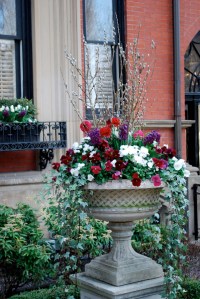 Ornate container with pansies, pussywillows and ivy